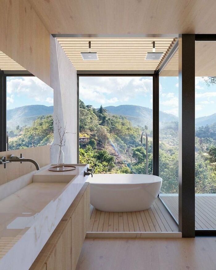 une salle de bain face à la nature