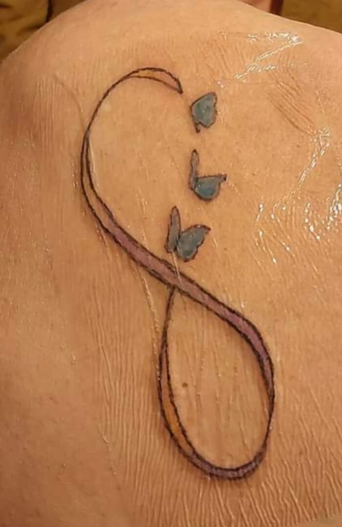 tatouage raté papillon