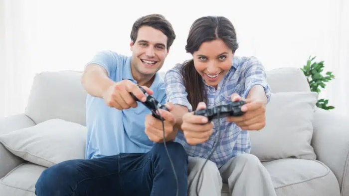 A man and a woman play video games